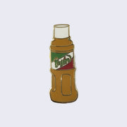 Enamel pin of a Tajin bottle packaging, with a gold outline.