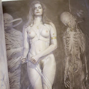 Illustration by Sorayama of a nude woman bound lightly with a thin, white rope. Beside her is a mummy and hanging skeleton.