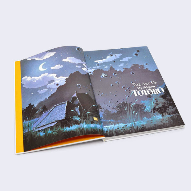Open two page book spread of title page. A nighttime illustration of a lush farmland with house in the background with many soot sprites floating up into the sky, "The Art of My Neighbor Totoro" is written in logo font in the far right.