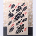 Black and red ink pattern style illustration on exposed wooden panel. The black elements are plant or bug inspired creatures, directioned like in flight. The red elements are like small amoeba creatures.