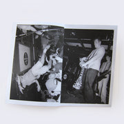 Open 2 page zine spread featuring black and white photography of scenes from punk rock style concerts, with close proximity to the performer or the crowd.