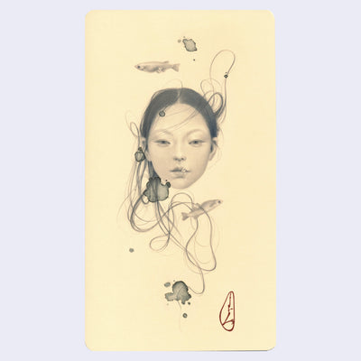 Soft graphite drawing on cream colored paper of a woman's head, with wisps of hair floating around her, 2 small fish swimming nearby.