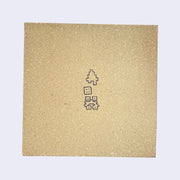 Back of ceramic tile, brown with drawn kanji-inspired symbols.