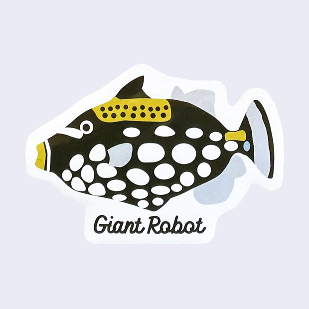 White cut out sticker of an illustrated Clown Triggerfish. "Giant Robot" is written in black cursive under the fish.