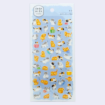 Sticker sheet with light blue background and many stickers of small kittens, playing or lounging around.