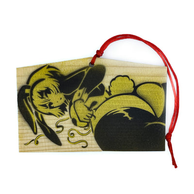 Rectangular pentagon wooden token with a red string attached at the top. Spray painted in gold and black in the front is an anime style woman with a curvaceous body and bunny costume lingerie, looking back and exposing her butt that has a cotton bunny tail on it. She wears bunny ears.