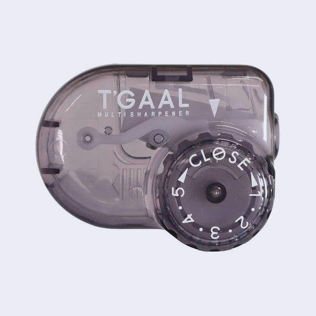 Transparent black pencil sharpener with 5 different dial settings for adjustments.