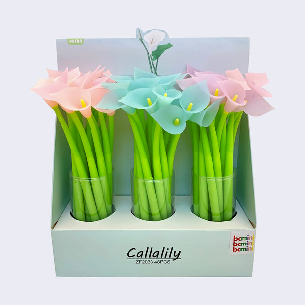 Pen display, "Callalily" written along the box and 3 clear cups hold light pink, blue, and darker pink lily flower topped pens.