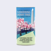 Tall cylindric can with a wrapping that features an illustration of many Cherry Blossom trees on a path that leads to The National Hall of Washington DC.