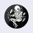 Black circle sticker with a drawing of skeleton clutching two swords. Small rocks and a key levitate around it.