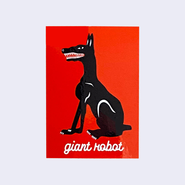 Red vertical rectangle sticker with an illustrated black Dobermann sitting profile view, with sharp white teeth and white accent details. "Giant Robot" is written in lowercase cursive font below the design.