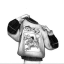Pencil drawing of a person wearing a sweater with 'Dragon Ball' logo. They pull the sweater off, hiding their head entirely.