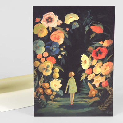 The front of note card is shown with an envelope behind it. The notecard has an illustration of a tiny girl surrounded by enormous flowers.