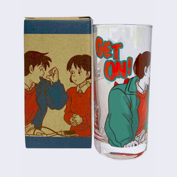 Glass cup with a screen printed design on the exterior of the cup, imagery borrowed from Whisper of the Heart, a man in a green jacket and red shirt, riding a bike and pointing behind him to a nervous looking girl, with text "Get On!" nearby.