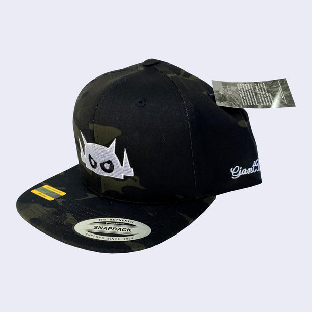 Dark camo patterned cap with a white embroidered Big Boss Robot head on the front of the cap.