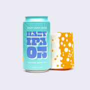 Teal blue can that reads "Hazy IPA 03" in psychedelic style font, next to a pair of rolled cream and orange socks with polka dots.