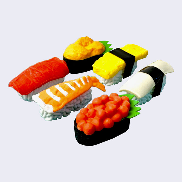 6 differently designed 3D sushi erasers. Sushi designs include roe, salmon, tuna, squid, tamago, and uni. 