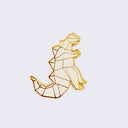 Enamel pin of an origami kaiju monster, standing and facing the right with spikes on its back and a large tail. Gold outlining.