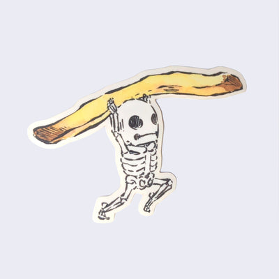 Sticker of a small cartoon skeleton holding a single french fry above its head.