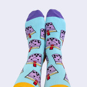 Front view of model's feet wearing chubby cartoon boba socks.