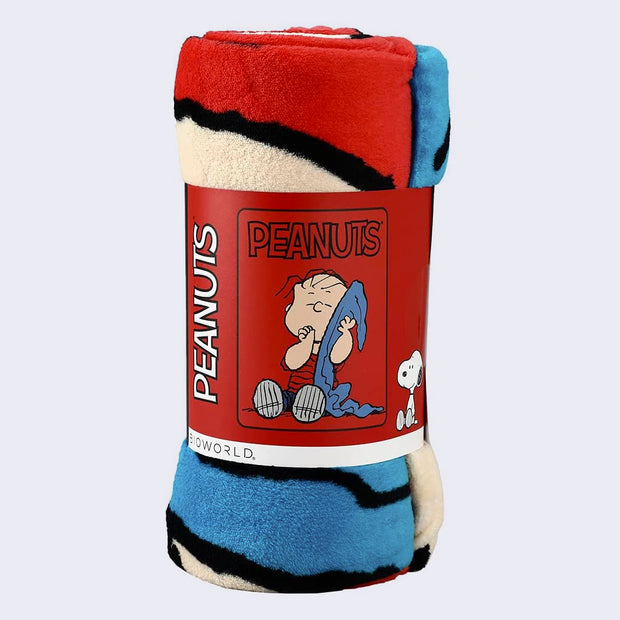 Rolled plush blanket, held in a cardboard wrapping, featuring a photo of the spread out blanket.