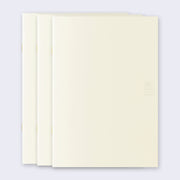 3 cream colored blank notebooks, stacked up on one another.