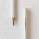 Sharpened gray color pencil and the bottom of another pencil, with "MD Paper Products" written in all caps on the side.