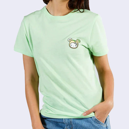Front side of person wearing pastel green t-shirt. A small Hello Kitty wearing a donut hat is printed on the left chest area. 