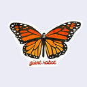 White cut out sticker with a brightly colored monarch butterfly, wings open. "Giant Robot" is written in dark orange cursive along the bottom.