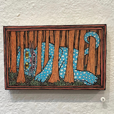 Illustration on wood of a large blue and white cloud patterned cat lying on the forest floor between many large tree trunks.
