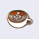 Gif of enamel pin of a brown latte in a white mug, with white decorative pattern in mug. One image is of pin in the light and the other is of the pin glowing in the dark.