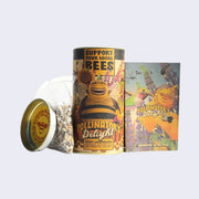 Tall cylindric can of Pollinator's Delight, with instructions and a clear bag with many different seeds.