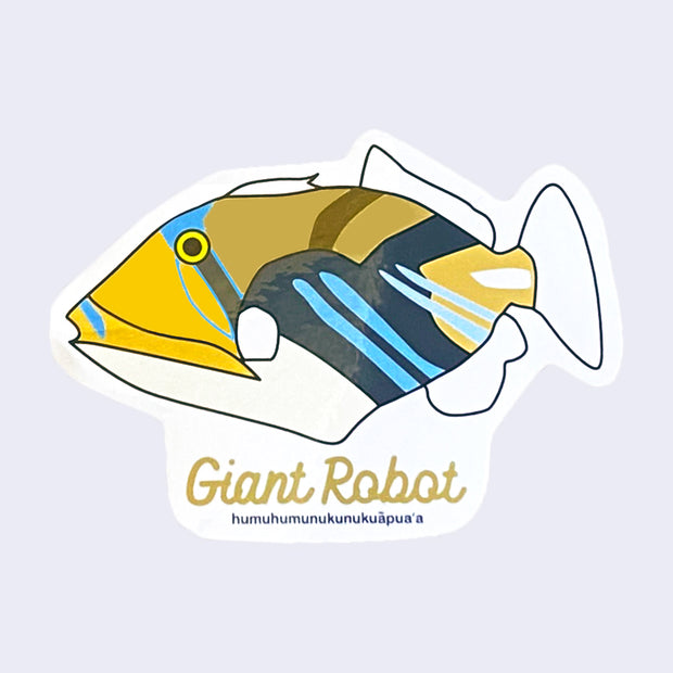 White cut out sticker with a Reef Trigger Fish. "Giant Robot" is written in tan cursive along the bottom, above text that reads the fish's Hawaiian name.
