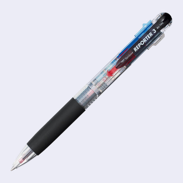 Clear bodied pen with a black grip, with 3 different clickable inks inside: red, black and blue.