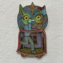 Illustration on wood of a rabbit monster in a sweater and pants whispering into a green goblin's ear.