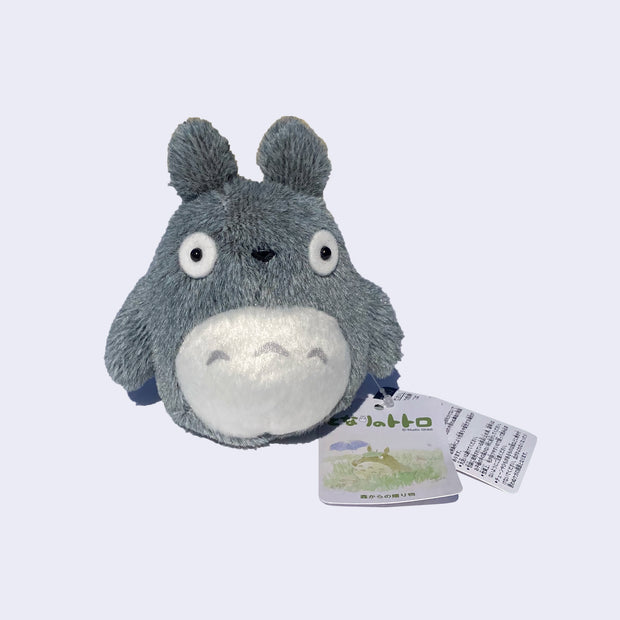Small light gray fluffy Totoro plush.