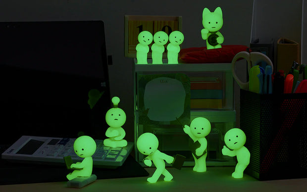 7 different design options for Smiski @ work, all glow in the dark. Each design described in previous photo's alt text.