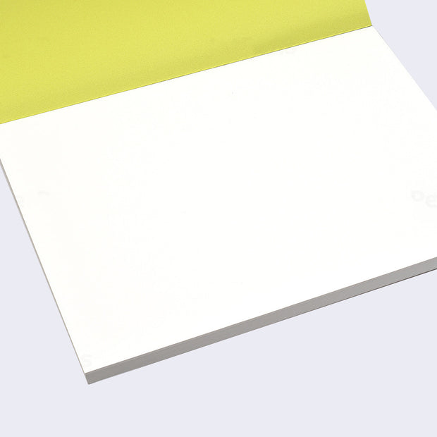 Open view of the sketch pad with the cover page flipped up, revealing a stack of bound blank white paper.