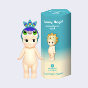 Vinyl figure of a Kewpie baby standing nude with a hood hat atop its head that resembles a peacock head with feathers. It stands next to a teal blue display box that reads "Sonny Angel Animal Series Ver. 4"