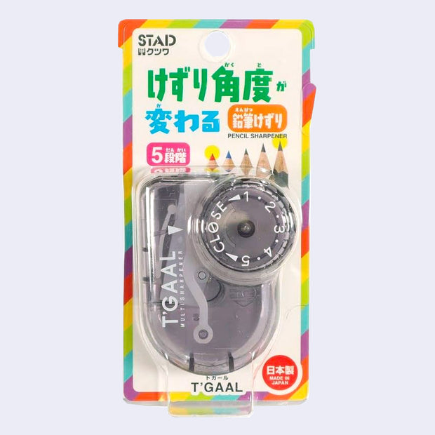 Transparent black pencil sharpener with 5 different dial settings for adjustments. Encased in product packaging with Japanese writing.