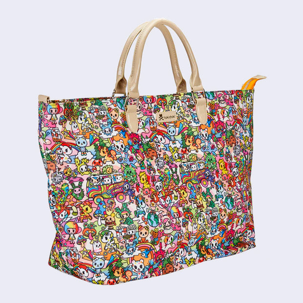 Large purse style tote bag, with beige pleather handle. A beige "tokidoki" name plate is in the upper center. Bag is covered completely in a very busy colorful pattern of various Tokidoki characters accompanied by elements reminiscent of 70's imagery, such as rainbows, mushrooms, VW Buses and flowers.