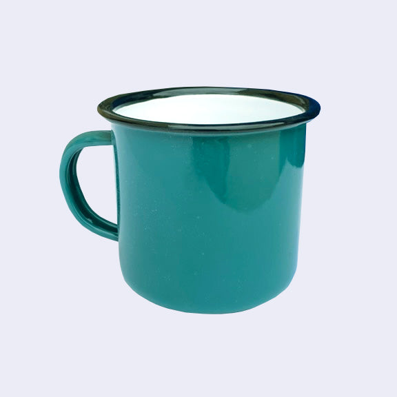 Back view of bright teal enamel mug with handle. Rim of the mug is lined black with a white interior.