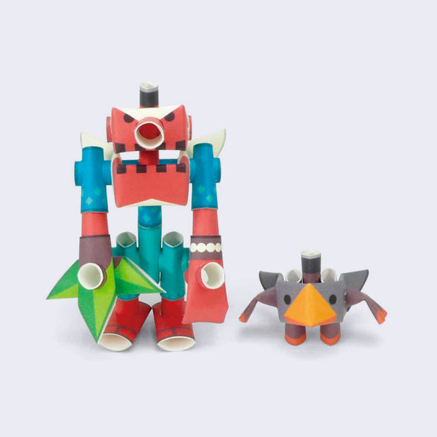 Sculpture of two figures built out of paper pipes. One is a mech robot with an octopus like face, primarily red with blue and green accents and next to it is a small gray cube bird creature with a large orange beak.