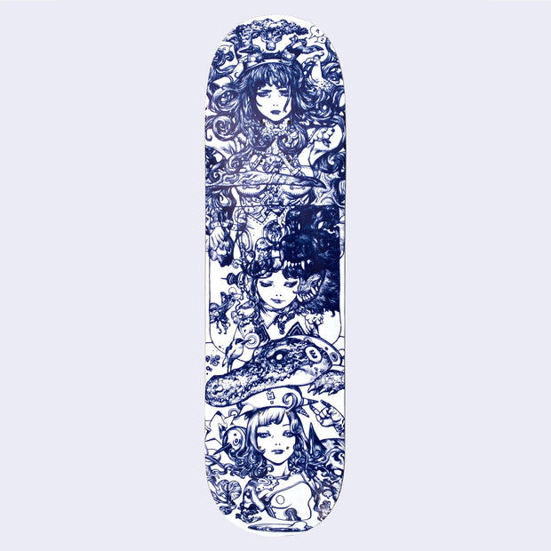 White skateboard deck with intricate deep blue line art illustration taking up the entirety of the deck. Three woman appear, the top one with a serious expression and tattooed body, with her breasts being covered by a bird with a long beak. Below is a younger girl with a slight smirk, looking down and to the side with a large angry bear growling near her head. Finally is a woman with a bored look and an alligator atop her head. 