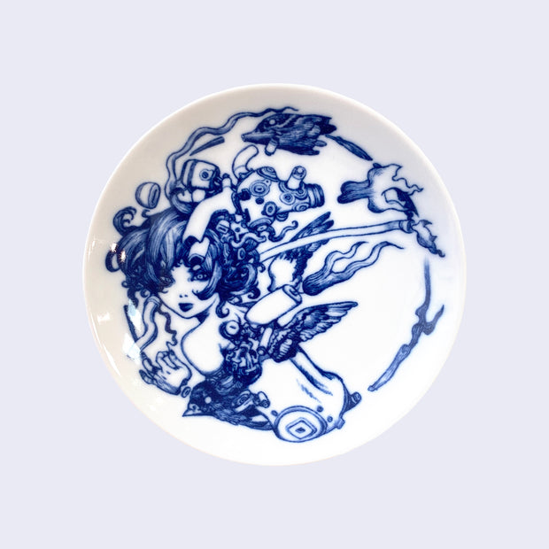 Small plate that features illustration of a woman facing away, her body breaking down into many mechanical parts.