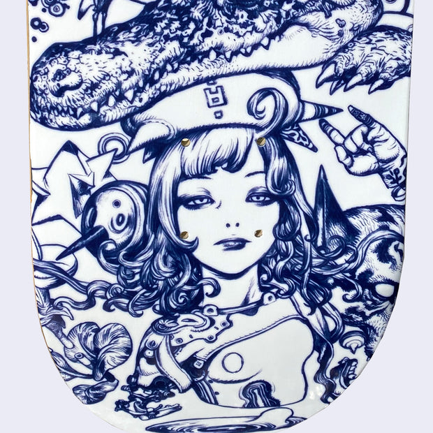 Close up of white skateboard deck with intricate blue line art illustration. Close up displays a woman, looking bored with slightly glazed eyes, wearing a helmet with spikes coming out of it. A bird's head is wrapped up in her hair and behind her you can see a floating hand making a "rock on" hand sign.