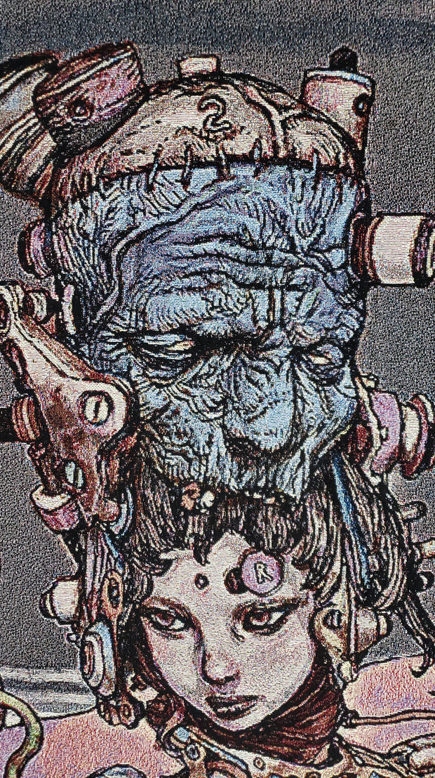 Close up of tapestry, displaying a woman with the face of an elderly man atop her head, with lots of mechanical parts attached.