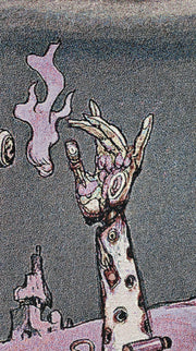 Close up of tapestry, displaying a mechanical arm reaching out to a flame. 
