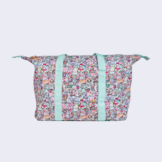 Rounded corner rectangular duffel bag, with mint blue fabric carrying handles. Bag has a small "tokidoki" nameplate on the upper center and is covered completely in a busy pastel color pattern featuring tokidoki characters with cafe food and drink imagery.