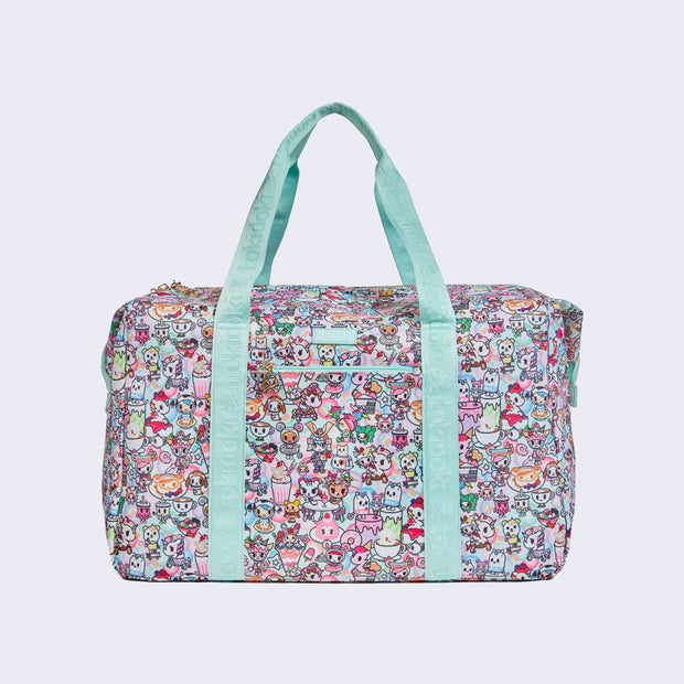 Rounded corner rectangular duffel bag, with mint blue fabric carrying handles. Bag has a small "tokidoki" nameplate on the upper center and is covered completely in a busy pastel color pattern featuring tokidoki characters with cafe food and drink imagery.